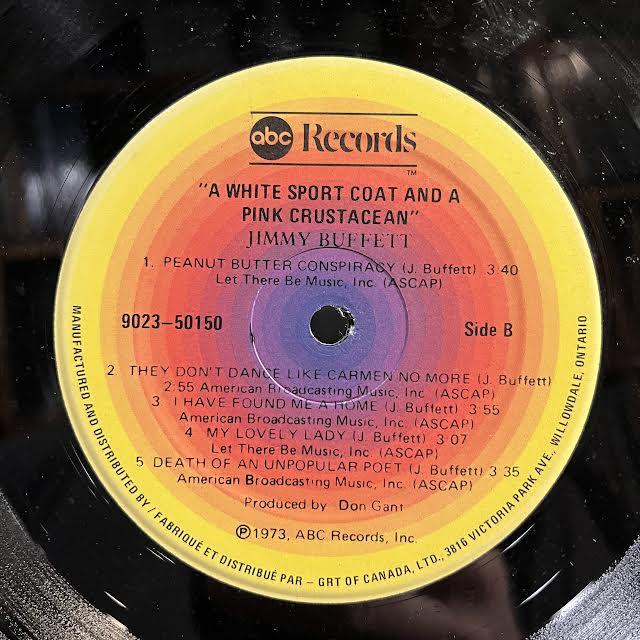 Jimmy Buffett - A White Sport Coat And A Pink Crustacean (CANADA) (VINYL) | Very Good (VG) Very Good Plus (VG+)