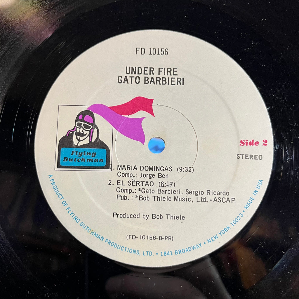 Gato Barbieri - Under Fire (VINYL) | Excellent (EX) Excellent (EX)