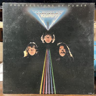 Triumph (2) - Progressions Of Power (VINYL) | Excellent+ (EX+) Excellent (EX)