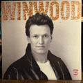 Steve Winwood - Roll With It (VINYL) | Near Mint- (NM-) Excellent+ (EX+)