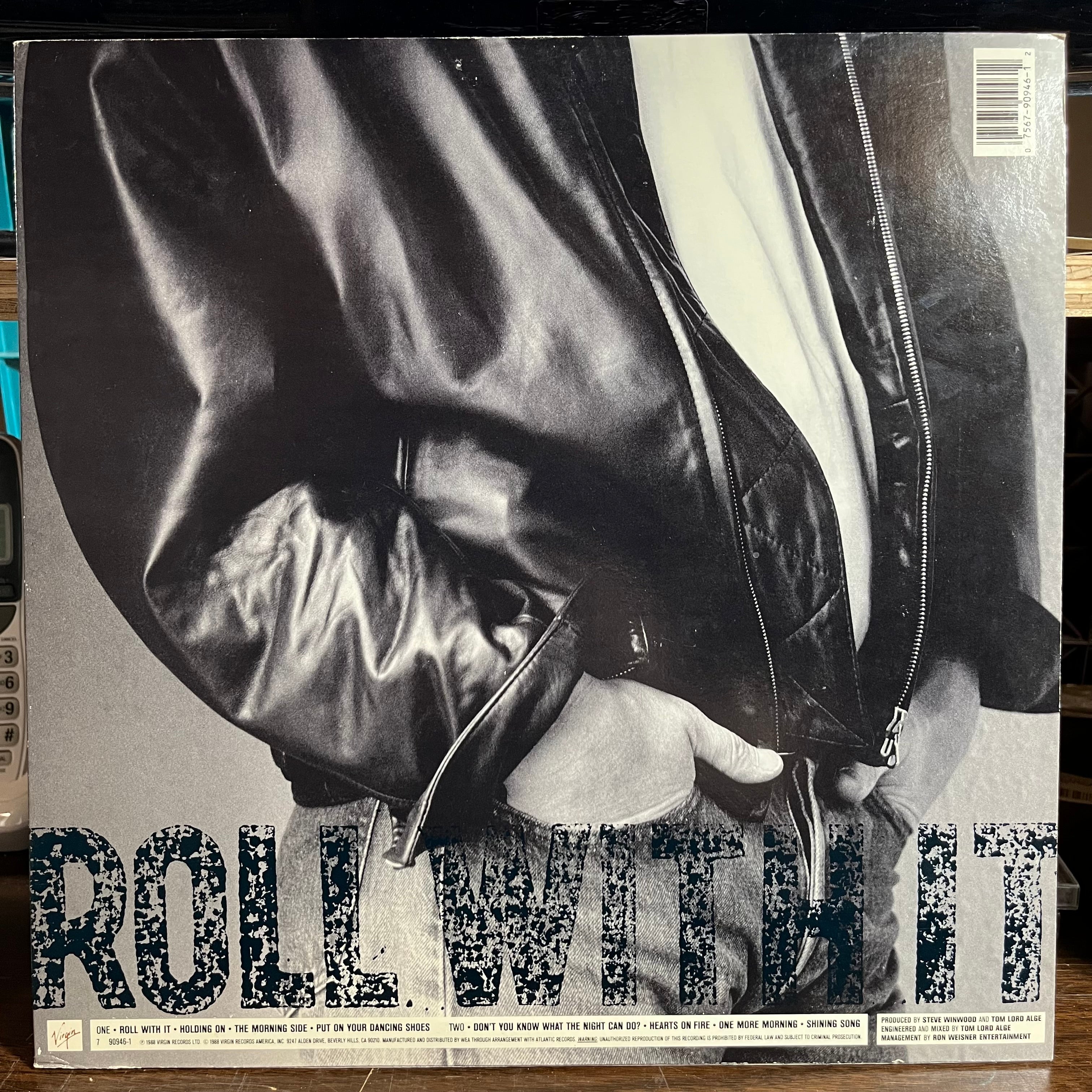 Steve Winwood - Roll With It (VINYL) | Near Mint- (NM-) Excellent+ (EX+)