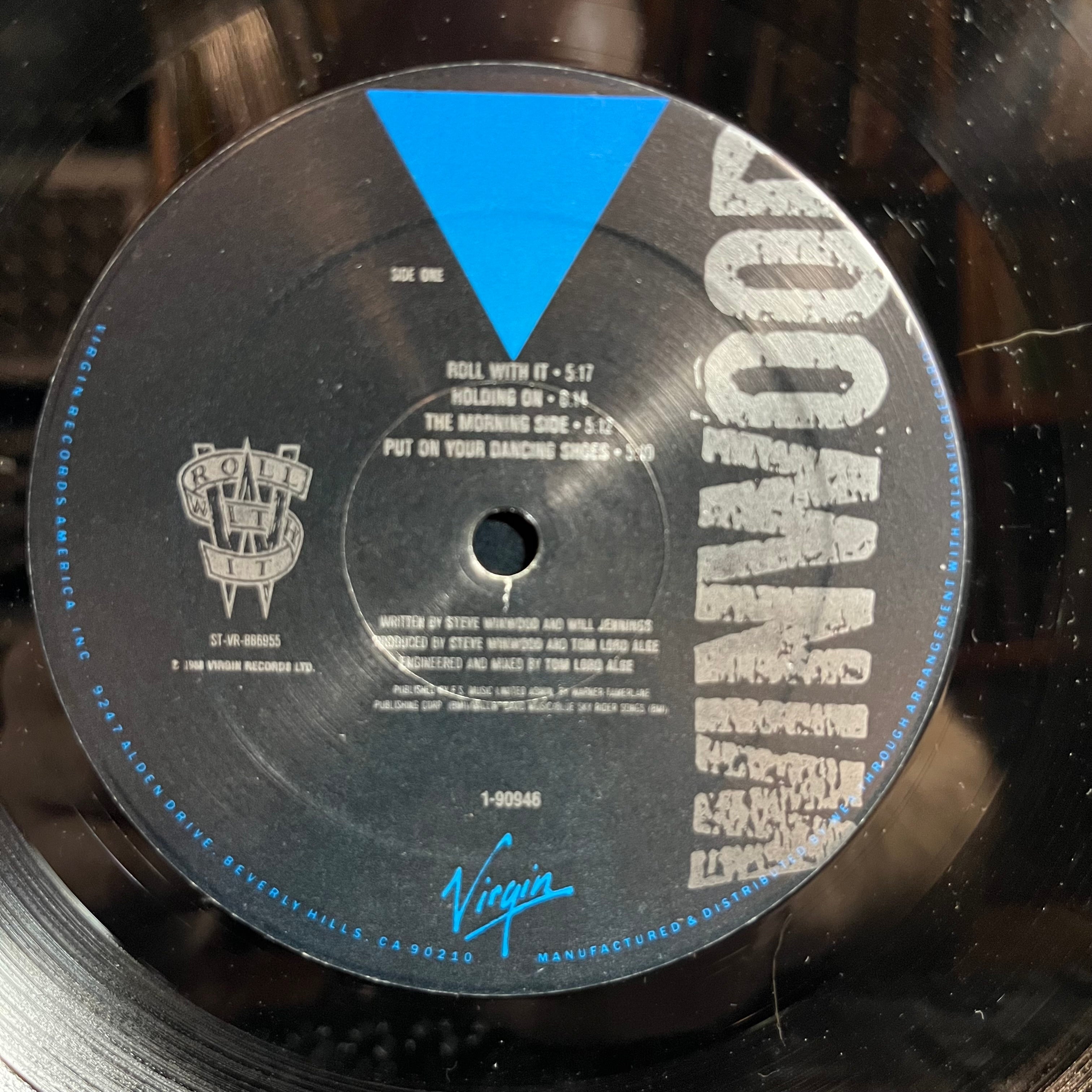 Steve Winwood - Roll With It (VINYL) | Near Mint- (NM-) Excellent+ (EX+)